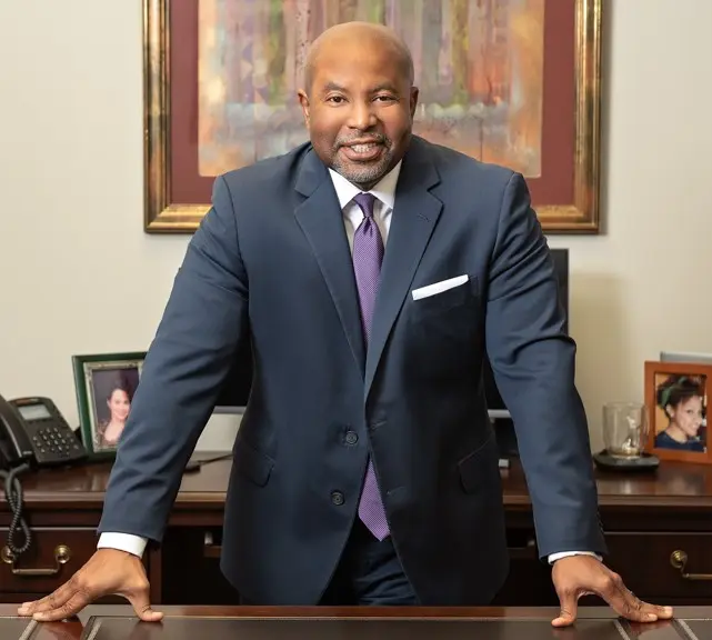 Dwaine Massey over his desk.