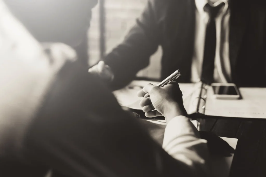 Businessmen discussing a contract.