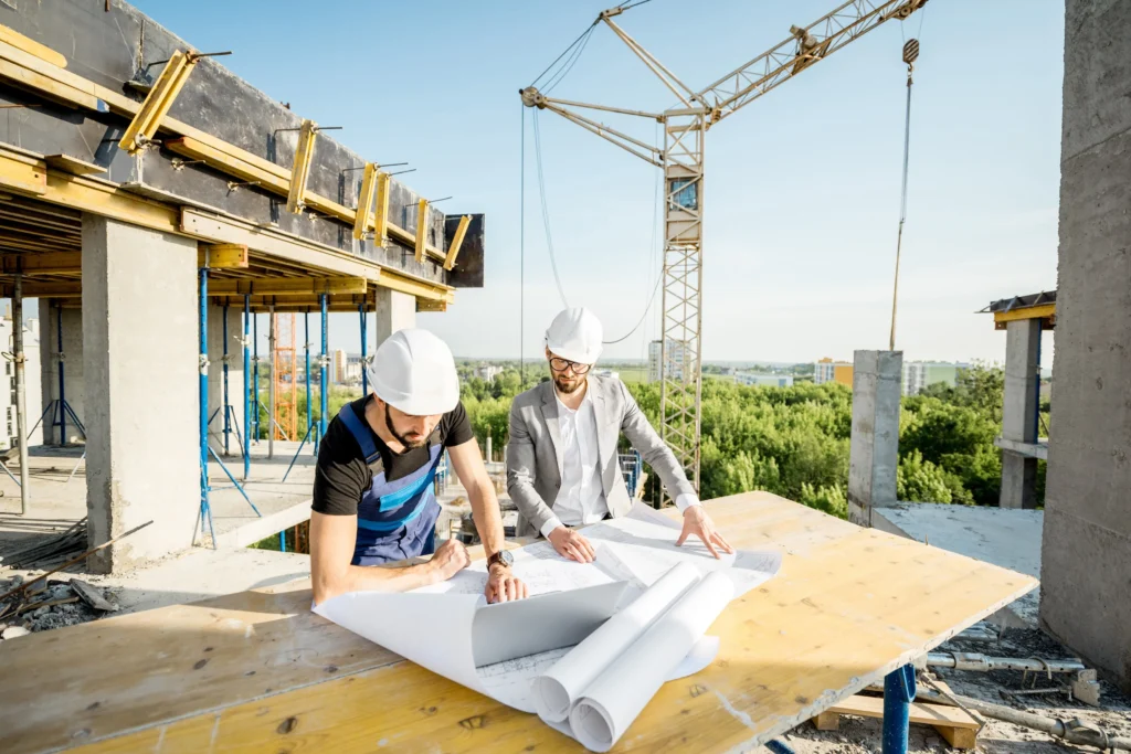 Construction workers looking at blueprints.