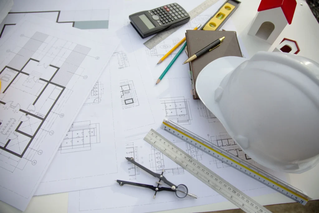 Hard hat on top of blueprints.